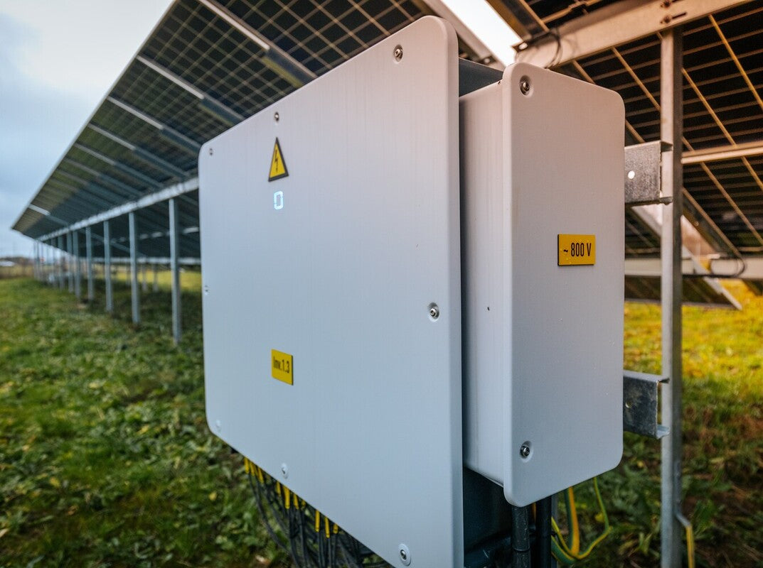 solar inverter installed at an outside solar farm, showing what a solar inverter is