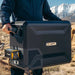 A Man Carrying BougeRV ASPEN 30 Dual-Zone 34QT 12V Portable Refrigerator With External Battery
