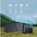 Portable power station displayed with solar panels in an outdoor setting, highlighting the charging efficiency and duration for various devices using wall outlets or solar energy