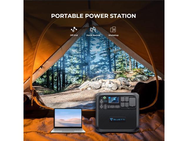 Inside a camping tent with a view of a forest, featuring a portable power station next to a laptop, demonstrating its off-grid capabilities